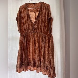 Brown floral free people mini dress. Ties at the waist and buttons on the front